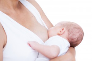 mother and newborn baby  lactation on white background